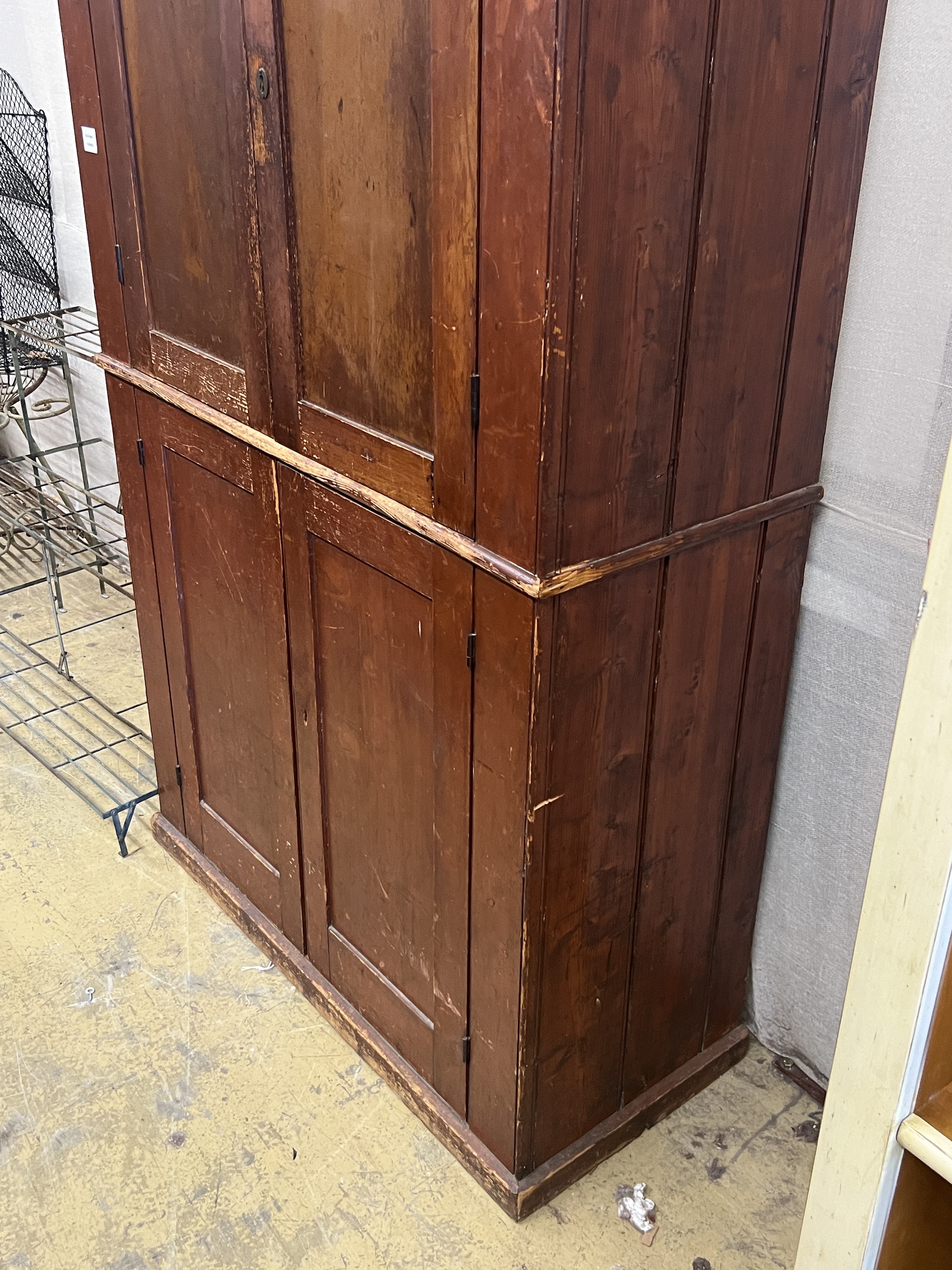 A Victorian pine four door household cupboard, width 109cm, depth 48cm, height 194cm